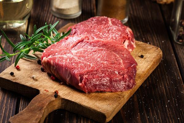 fresh raw beef steak sirloin with rosemary